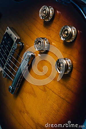 Yellow electric guitar on the wall Stock Photo