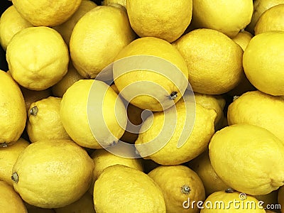 Yellow lemon fruit, Citrus limon L. consist of citric acid compound, yellow texture or background, sell in market shelf. Stock Photo