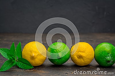 Yellow lemon and lime with fresh on black background Stock Photo