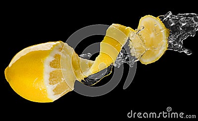 Yellow lemon splash macro isolated over black Stock Photo