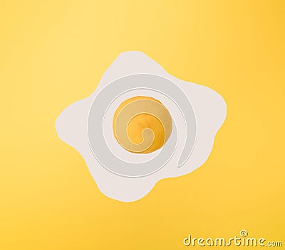Yellow lemon on white and yellow paper. Minimal scrambled eggs design Stock Photo