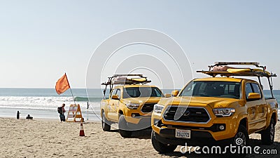 Yellow lifeguard car, beach near Los Angeles. Rescue Toyota pick up truck, lifesavers California USA Editorial Stock Photo