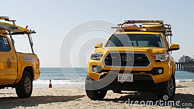 Yellow lifeguard car, beach near Los Angeles. Rescue Toyota pick up truck, lifesavers California USA Editorial Stock Photo