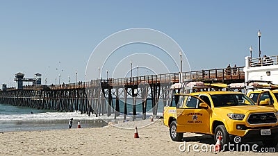 Yellow lifeguard car, beach near Los Angeles. Rescue Toyota pick up truck, lifesavers California USA Editorial Stock Photo