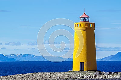 Yellow lighthouse and on a clear and sunny day Stock Photo