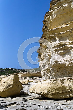 Yellow limestone cliffs on the coast of Malta. Stock Photo