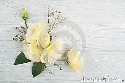Yellow lisianthus flowers and lit candle Stock Photo