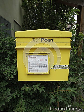 Yellow mail box for sending Editorial Stock Photo