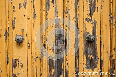 Yellow maltese door with paint Stock Photo