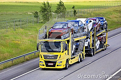 Yellow MAN TGS Car Carrier Hauls New Cars Editorial Stock Photo