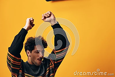 Student man stylish fashion trendy happy style orange background smile portrait sweater Stock Photo