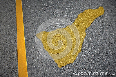 yellow map of tenerife on asphalt road near yellow line Stock Photo