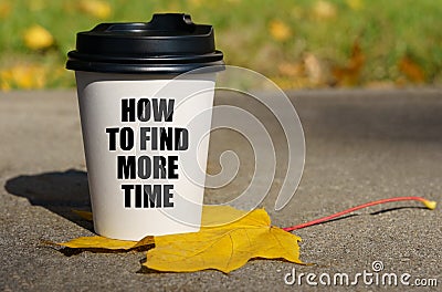 On a yellow maple leaf there is a cup of coffee on which is written - How to find more time Stock Photo