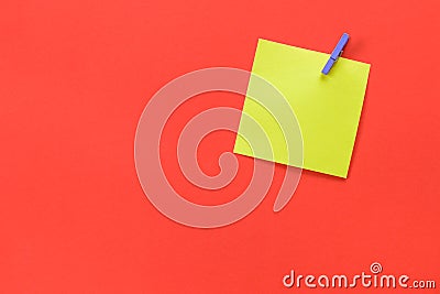 Yellow memo post with space for text isolated on a red background Stock Photo