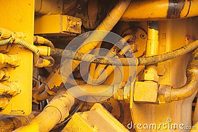 Yellow motor engine machine excavator hydraulic tractor vehicle closeup Stock Photo
