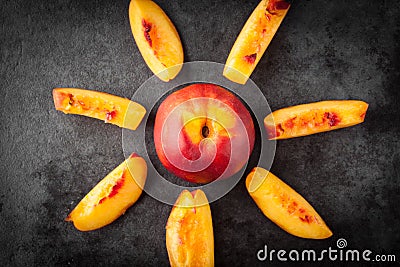 Yellow nectarine peach whole and slices Stock Photo