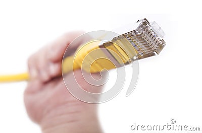Yellow network cable in babys hand Stock Photo