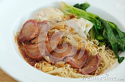 yellow nooddle with honey pork roasted and dumpling Stock Photo