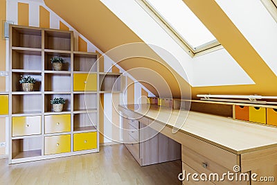 Yellow office room in an attic Stock Photo