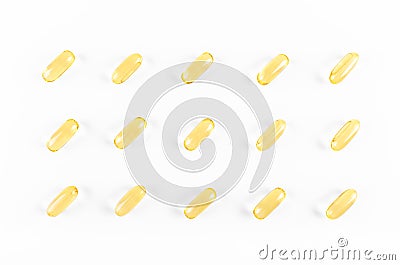 Yellow omega capsules on white background, abstract pattern Stock Photo