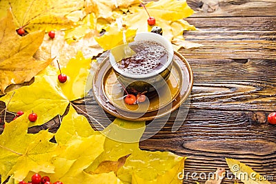 Yellow and orange fallen maple leaves on wooden background Stock Photo