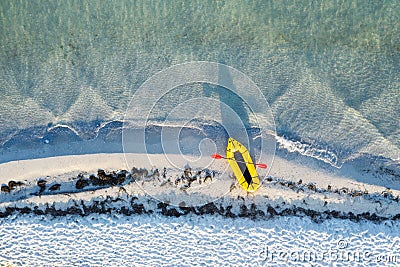 Yellow packraft rubber boat with red padle Stock Photo