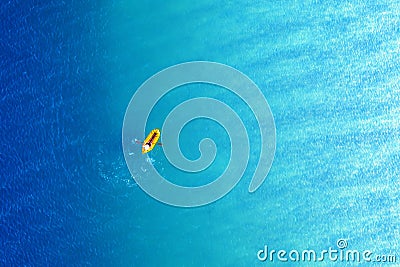 Yellow packraft rubber boat and turquoise water Stock Photo