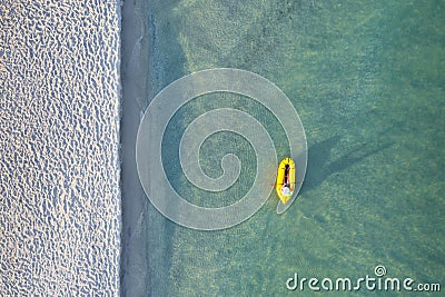 Yellow packraft rubber boat and turquoise water Stock Photo