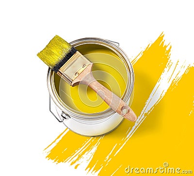 Yellow paint tin can with brush Stock Photo