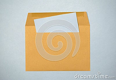 Yellow paper envelope on a blue background Stock Photo