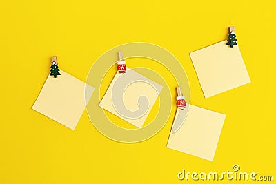 Yellow paper memo notes decorated christmas tree. Blank sticky square reminder Stock Photo