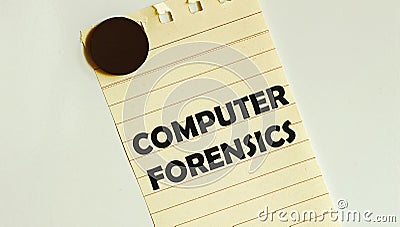 Yellow paper with text Computer Forensics on the white fridge Stock Photo
