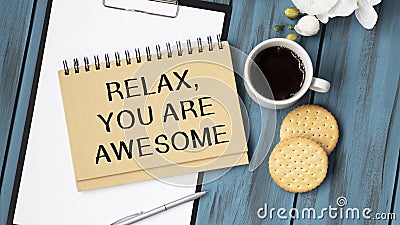 yellow paper with text Relax, you are awesome Stock Photo