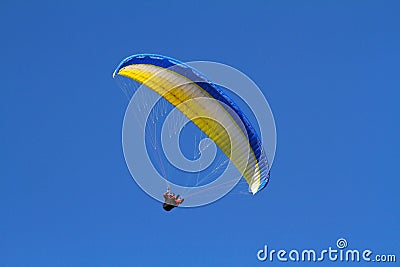 Yellow paraglider Stock Photo