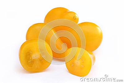 Yellow pear-shape cherry tomatoes whole and cut isolated Stock Photo