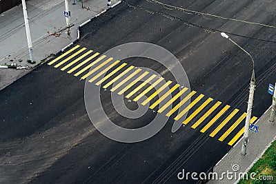 Yellow pedestrian crossing across the road Stock Photo