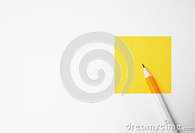 Yellow pencil on a white background, minimalism. Abstract art, imagination, education Stock Photo