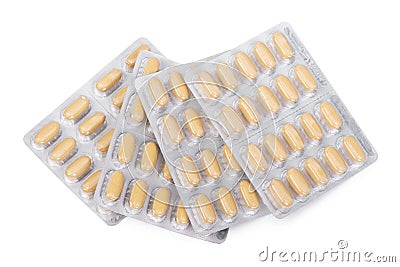 Yellow pills in a blister pack Stock Photo