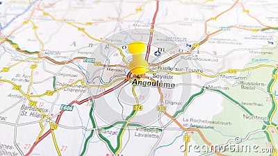 A yellow pin stuck in Angouleme on a map of France Stock Photo