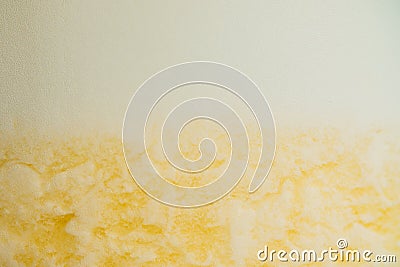 Yellow pineapple cocktail with white foam background. White foam drink Stock Photo