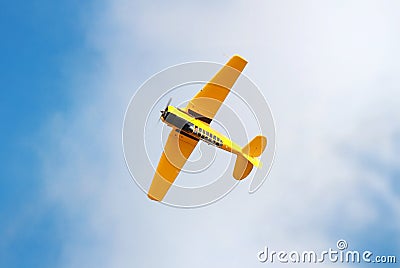 Yellow plane in the sky Stock Photo