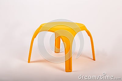 Yellow plastic childrens table on white background Stock Photo