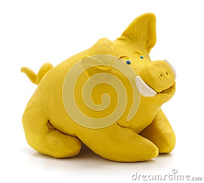 Yellow plasticine pig Stock Photo