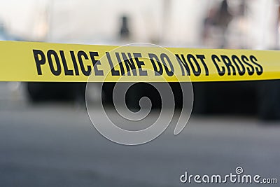 Yellow police line tape Stock Photo