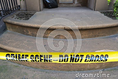 Yellow police tape with the text: crime scene do not cross Stock Photo