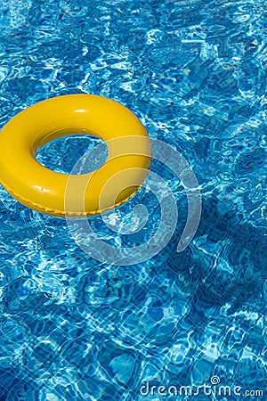 Yellow pool float, pool ring in cool blue refreshi Stock Photo