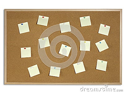 Yellow Post It Notes tacked on Cork Board Stock Photo