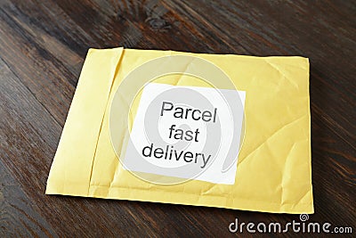 Yellow postal envelope Stock Photo