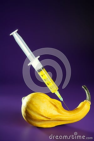 Yellow pumpkin and syringe Stock Photo