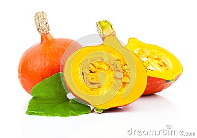 Yellow pumpkins vegetables with green leaves Stock Photo